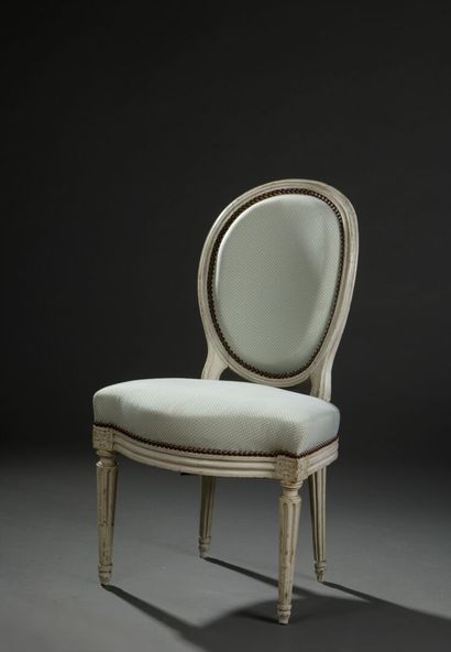 Louis XVI period molded and carved wood chair.
Medallion-backed,...