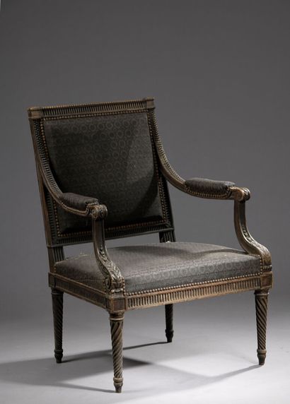 Large molded and carved wooden armchair from...
