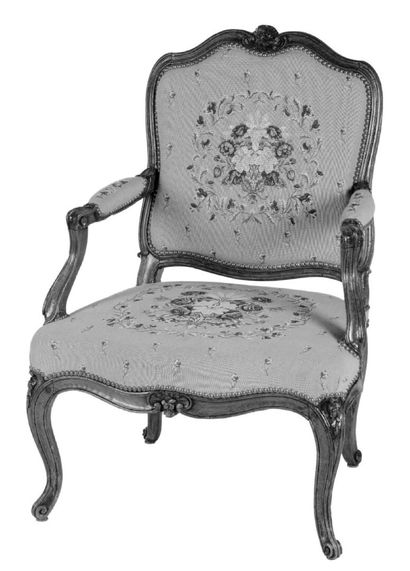 Molded and carved beech armchair stamped...