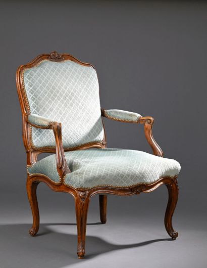 Molded and carved beech armchair stamped...