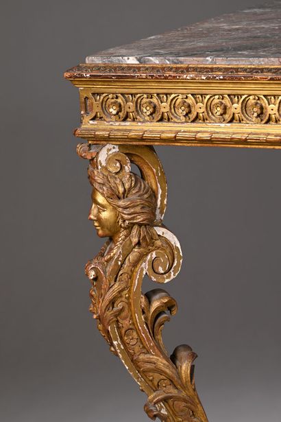 Middle table in molded, carved and gilded...