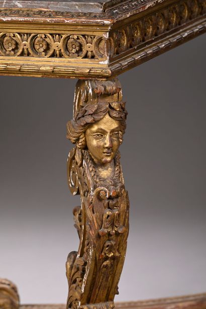 Middle table in molded, carved and gilded...