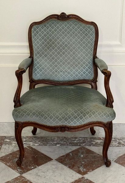 Molded and carved beech armchair stamped...