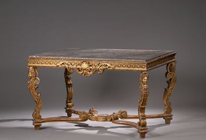 Middle table in molded, carved and gilded...