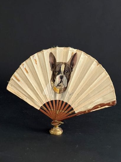 Folded fan, circa 1900,
Wooden frame with...