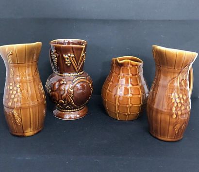 LOT of four barbotine pitchers including:
-...