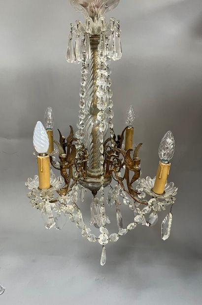Chandelier with 4 light arms and winged sphinxes.
Modern.
H:...