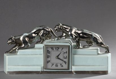 Porcelain CLOCK decorated with two silvered...