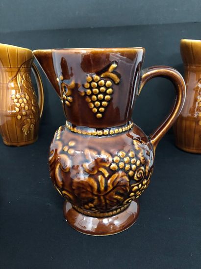 LOT of four barbotine pitchers including:
-...