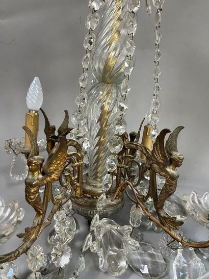 Chandelier with 4 light arms and winged sphinxes.
Modern.
H:...