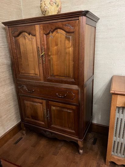 ARMOIRE opening with four leaves and a drawer....