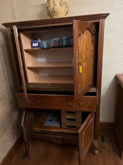 ARMOIRE opening with four leaves and a drawer....