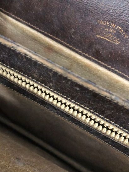 GUCCI : 
Brown leather clutch bag with flap,...