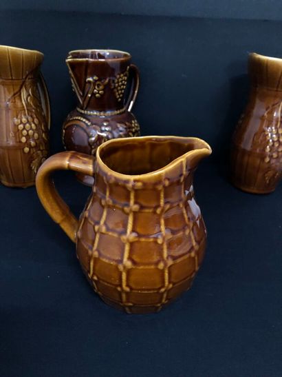 LOT of four barbotine pitchers including:
-...