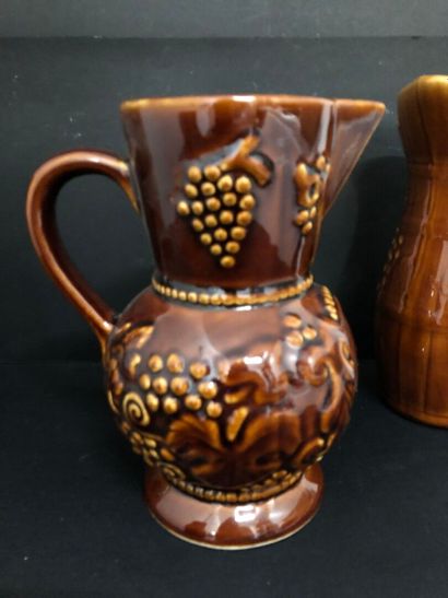 LOT of four barbotine pitchers including:
-...