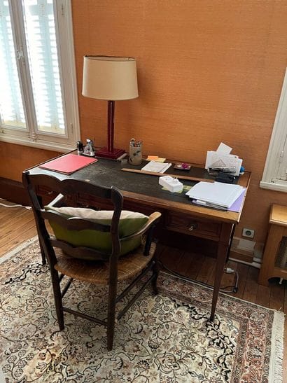 Writing table resting on four tapered legs...