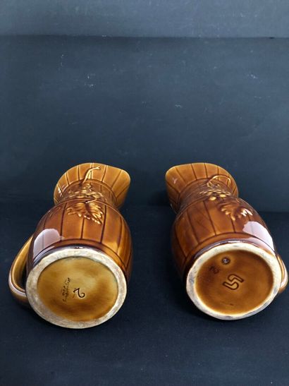 LOT of four barbotine pitchers including:
-...