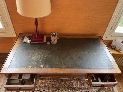 Writing table resting on four tapered legs...