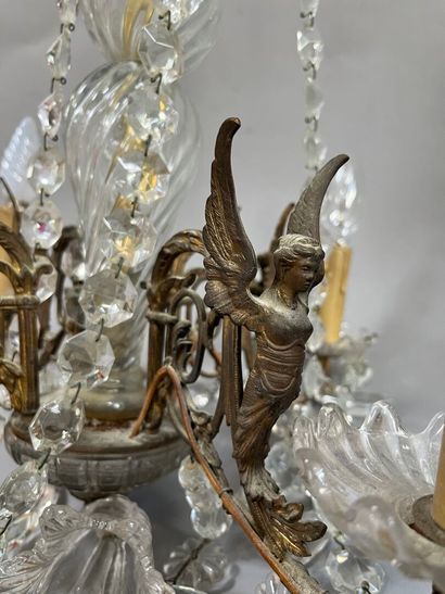Chandelier with 4 light arms and winged sphinxes.
Modern.
H:...