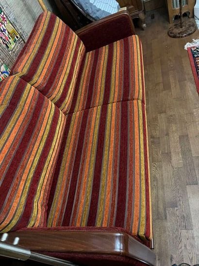 Convertible two-seater sofa with striped...