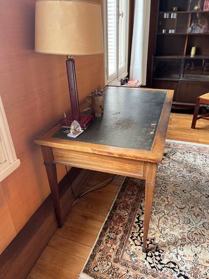 Writing table resting on four tapered legs...