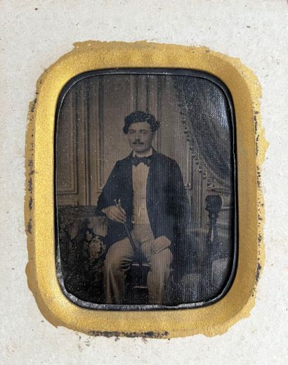 DAGUERREOTYPE : 
Seated man holding a cane...