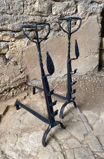 17th-century wrought-iron andirons
Decorated...