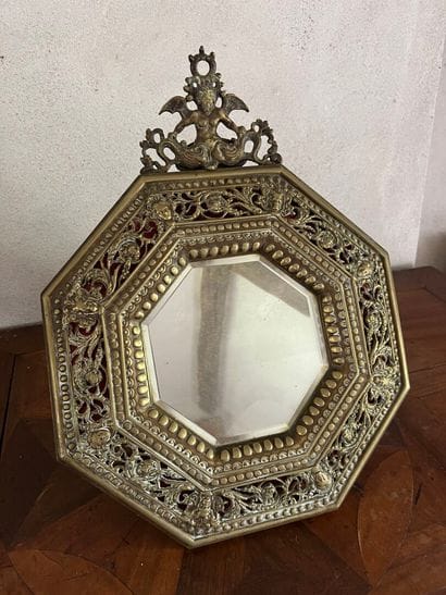 Brass repoussé mirror in the Renaissance...