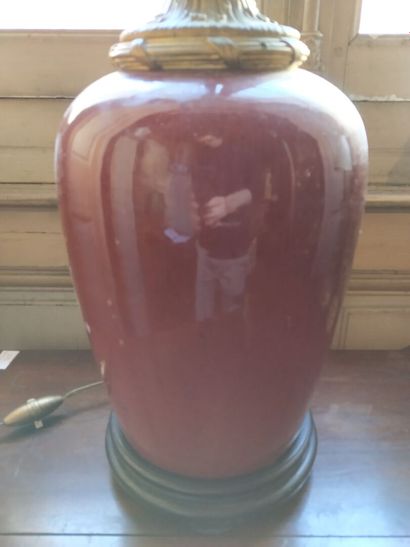 Oxblood earthenware lamp, bronze mounting,...