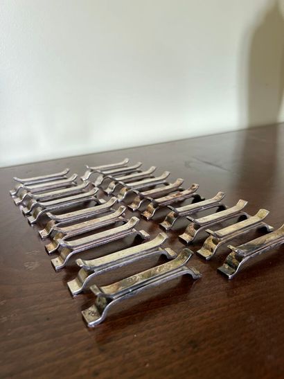 Suite of 19 silver-plated knife-holders,...