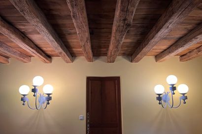 Pair of three-light sconces in lacquered...