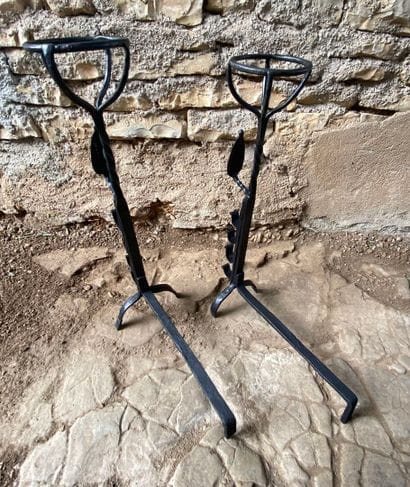 17th-century wrought-iron andirons
Decorated...