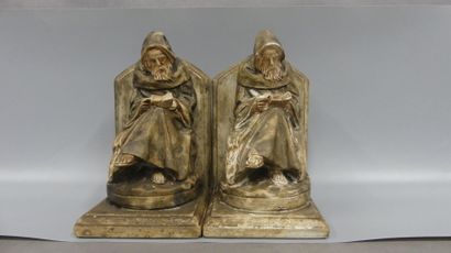 A pair of bookends in patinated plaster:...