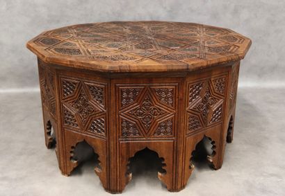 A richly carved Syrian dodecagon coffee table
H...