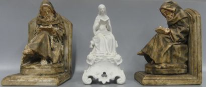 A pair of bookends in patinated plaster:...