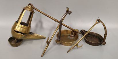 A set of three bronze oil lamps
One in the...