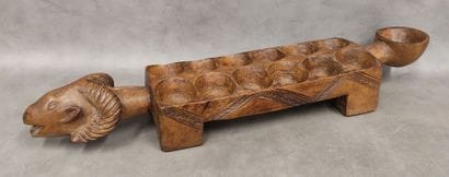 An awale game tray decorated with a ram's...