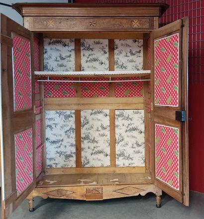 A two-door Transition-style cabinet decorated...