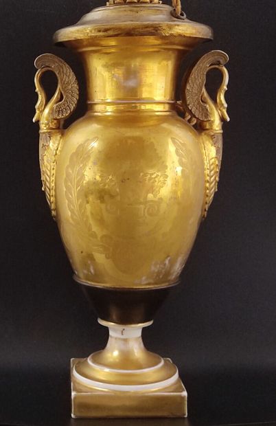 A gilded porcelain de Paris lamp base 
decorated...