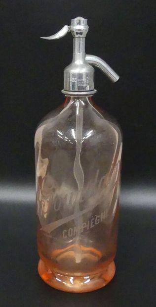 A pink glass bottle of seltzer
Ch .Gourdain...