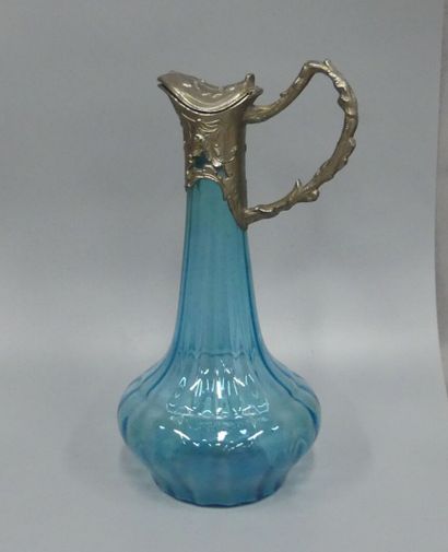 A blue glass ewer with gadroon motifs
and...