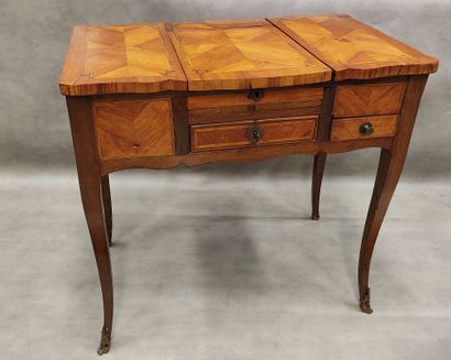 A small dressing table in marquetry with...