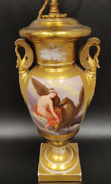 A gilded porcelain de Paris lamp base 
decorated...