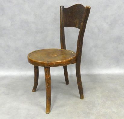 A small bistro-style children's chair in...