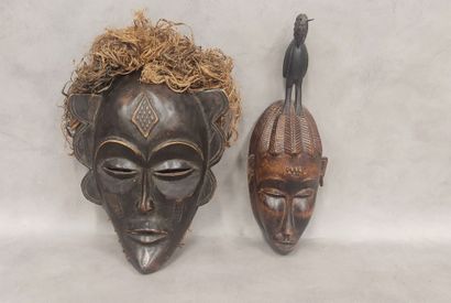 A set of 7 modern wooden masks including...