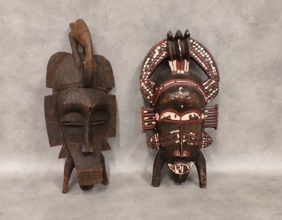 A set of 7 modern wooden masks including...