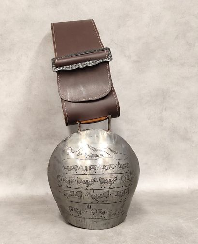 A modern bell decorated with engraved cows
with...
