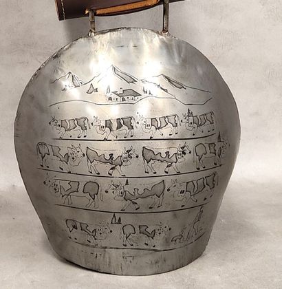 A modern bell decorated with engraved cows
with...