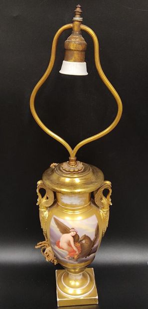 A gilded porcelain de Paris lamp base 
decorated...