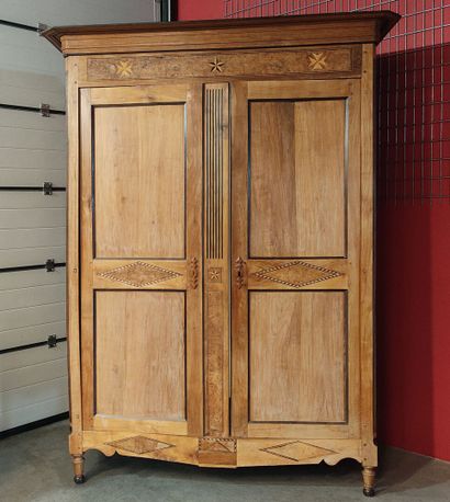 A two-door Transition-style cabinet decorated...